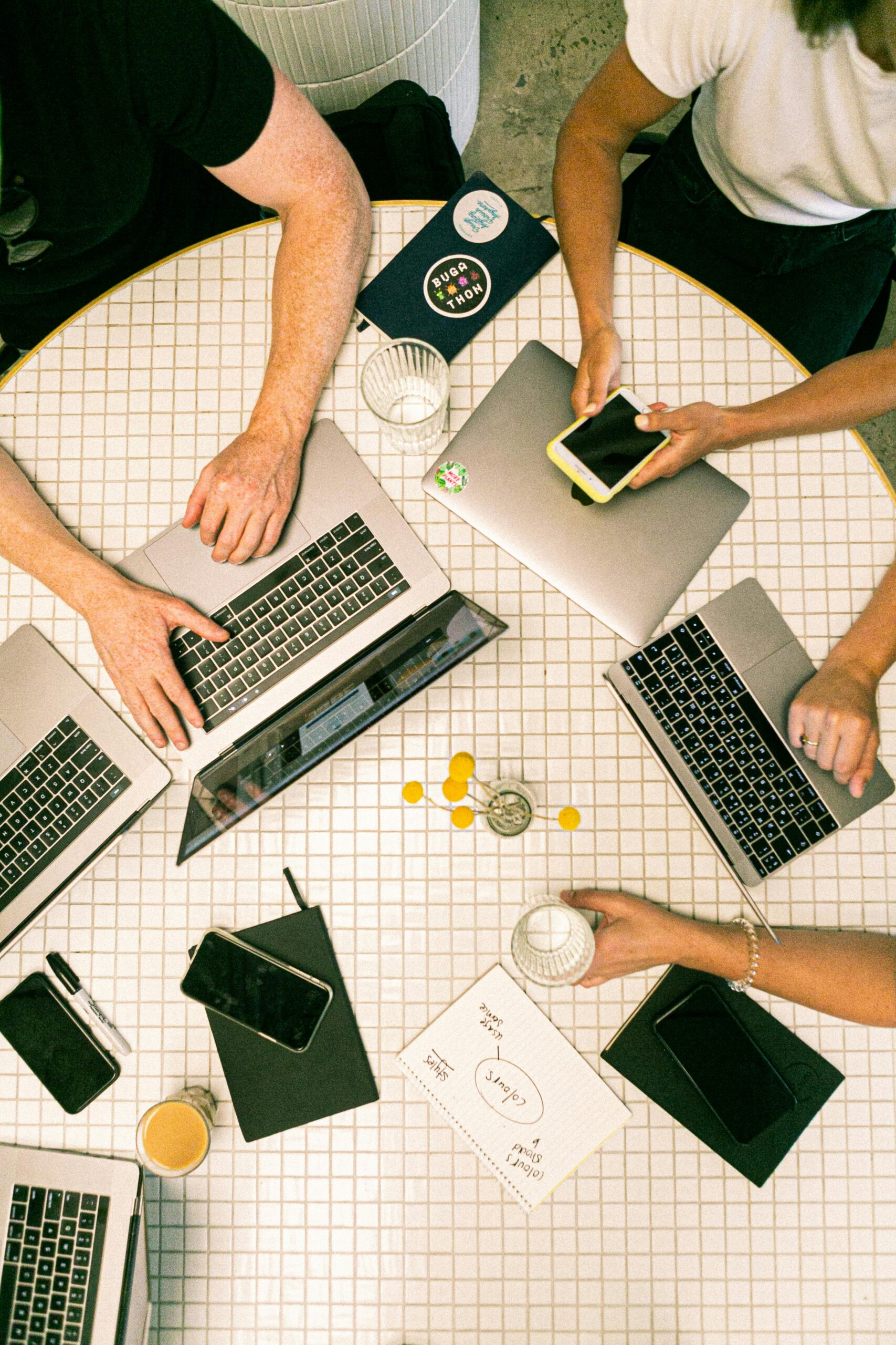Digital marketing team working on SEO strategy and website optimization using laptops in a modern office